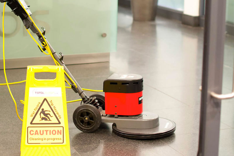 office cleaning with red professional hoover